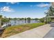 Waterfront backyard providing a serene view and direct access to the lake at 1501 84Th N Ave, St Petersburg, FL 33702