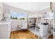 Bright bedroom featuring a loft bed, study area, and comfortable chair at 1501 84Th N Ave, St Petersburg, FL 33702