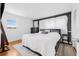 Primary bedroom with a large bed, neutral rug and simple, modern decor at 1501 84Th N Ave, St Petersburg, FL 33702