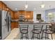Well-equipped kitchen with stainless steel appliances, granite countertops, and ample cabinetry at 16916 Dorman Rd, Lithia, FL 33547
