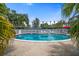 Sparkling community pool with lounge chairs and a serene, well-kept environment at 1715 Belleair Forest Dr # C, Belleair, FL 33756