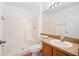 Bathroom features a tub, a shower, large mirror, and vanity at 18106 Lembrecht Way, Tampa, FL 33647