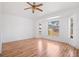 Spacious bedroom features a bay window, hardwood floors, and white walls at 18106 Lembrecht Way, Tampa, FL 33647