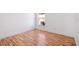 Bright bedroom featuring sleek hardwood floors and crisp white walls at 18106 Lembrecht Way, Tampa, FL 33647
