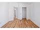 Bedroom with doors to other rooms, closet, hardwood floors and neutral paint at 18106 Lembrecht Way, Tampa, FL 33647