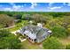 Stunning aerial view of an expansive property featuring a beautiful two-story home surrounded by lush landscaping at 18929 Crescent Rd, Odessa, FL 33556