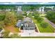 Stunning aerial view of this amazing property featuring a two-story home, pool, and lake views at 18929 Crescent Rd, Odessa, FL 33556