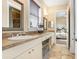 Spacious bathroom with double vanity, views to the primary bedroom, and bright natural light at 18929 Crescent Rd, Odessa, FL 33556