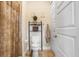 The bathroom features a toilet, shelving, and updated fixtures at 18929 Crescent Rd, Odessa, FL 33556