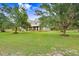 Expansive lawn and mature trees frame this lovely two-story home at 18929 Crescent Rd, Odessa, FL 33556