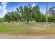 Charming home with a well-maintained front yard and a rustic wooden fence at 18929 Crescent Rd, Odessa, FL 33556