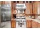 Updated kitchen with stainless steel appliances, wood cabinetry, and granite countertops at 18929 Crescent Rd, Odessa, FL 33556