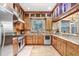 Kitchen with stainless steel appliances, granite counters, and custom wood cabinetry at 18929 Crescent Rd, Odessa, FL 33556