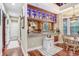 Kitchenette with granite counters, wood cabinetry with blue LED accent lighting at 18929 Crescent Rd, Odessa, FL 33556