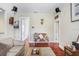 Inviting living room with hardwood floors and seating area featuring a decorative deer head at 18929 Crescent Rd, Odessa, FL 33556