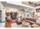 Spacious living room features hardwood floors, a leather sectional, and a decorative hutch at 18929 Crescent Rd, Odessa, FL 33556