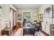Home office with neutral walls and trim, hardwood floors, and large desk area at 18929 Crescent Rd, Odessa, FL 33556