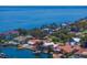 An aerial view of waterfront real estate showcases luxurious properties with private docks and backyard pools at 1941 Kentucky Ne Ave, St Petersburg, FL 33703