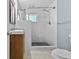 Bathroom with a tiled shower, modern fixtures, and a sleek vanity, offering a clean and functional space at 2026 Cocoanut Ave, Sarasota, FL 34234