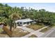 Charming single-story home with a well-manicured front yard, mature trees, and a welcoming facade at 2026 Cocoanut Ave, Sarasota, FL 34234
