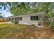 A lovely exterior of a one-story house with dark trim around windows and doors at 2026 Cocoanut Ave, Sarasota, FL 34234