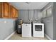 Laundry room equipped with modern washer, dryer, and storage cabinets at 2026 Cocoanut Ave, Sarasota, FL 34234