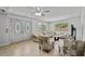 Open living room showcasing a ceiling fan, neutral furniture, and tile flooring at 2026 Cocoanut Ave, Sarasota, FL 34234