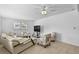 Open concept living room with modern furnishings and natural light from the windows at 2026 Cocoanut Ave, Sarasota, FL 34234