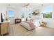 Bright and airy main bedroom with many windows for natural light and wood floors at 2104 4Th S St, St Petersburg, FL 33705