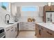 Bright kitchen with modern appliances, white countertops, and neutral cabinets at 2104 4Th S St, St Petersburg, FL 33705