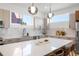 Modern kitchen with a large island, stainless steel appliances, and stylish pendant lighting at 2104 4Th S St, St Petersburg, FL 33705