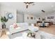 Bright living room with a white sectional sofa, open floorplan, and contemporary decor at 2104 4Th S St, St Petersburg, FL 33705