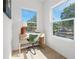 Bright home office with large windows offering neighborhood views and light colored wood floors at 2104 4Th S St, St Petersburg, FL 33705