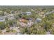 An aerial view of the property showcases its location among mature trees at 2114 S Venus St, Tampa, FL 33629