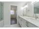Bathroom showcasing double sinks, marble countertops and contemporary design at 2114 S Venus St, Tampa, FL 33629