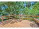 Spacious deck has built-in benches and overlooks lush greenery at 2114 S Venus St, Tampa, FL 33629