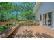 Spacious deck has built-in benches and overlooks lush greenery at 2114 S Venus St, Tampa, FL 33629