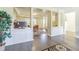Bright living area with grey wood floors and built-in storage, creating an inviting space at 2114 S Venus St, Tampa, FL 33629
