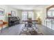 A dedicated office space with hardwood floors, a desk, a piano, and lots of natural light at 2114 S Venus St, Tampa, FL 33629