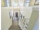 View from the top of the staircase looking down into the main entrance at 2114 S Venus St, Tampa, FL 33629