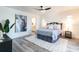 Comfortable bedroom with neutral decor, a patterned rug, and an ensuite bathroom at 2161 Aqui Esta Dr, Punta Gorda, FL 33950
