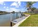 Home with private dock, providing direct access to the beautiful canal at 2161 Aqui Esta Dr, Punta Gorda, FL 33950