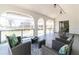 This covered patio offers plenty of seating options and views of the community at 2161 Aqui Esta Dr, Punta Gorda, FL 33950