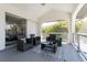 Inviting outdoor patio with comfortable seating and views of the surrounding tropical landscape at 2161 Aqui Esta Dr, Punta Gorda, FL 33950
