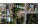 Real estate aerial view of a charming single-Gathering home featuring a long driveway and well-maintained landscaping at 2167 Corfell St, Port Charlotte, FL 33948