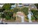 Real estate aerial view of a charming single-Gathering home featuring a long driveway and well-maintained landscaping at 2167 Corfell St, Port Charlotte, FL 33948