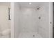 Modern bathroom with marble tile walk-in shower and unique mosaic tile floor at 2167 Corfell St, Port Charlotte, FL 33948