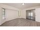 Bedroom featuring wood-look flooring, natural light, and a sliding glass door at 2167 Corfell St, Port Charlotte, FL 33948