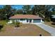 Charming single-story home with a well-manicured front yard and attached garage providing curb appeal at 2167 Corfell St, Port Charlotte, FL 33948