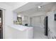 Bright, spacious kitchen with white cabinets, marble floors, quartz countertops, and stainless appliances at 2167 Corfell St, Port Charlotte, FL 33948
